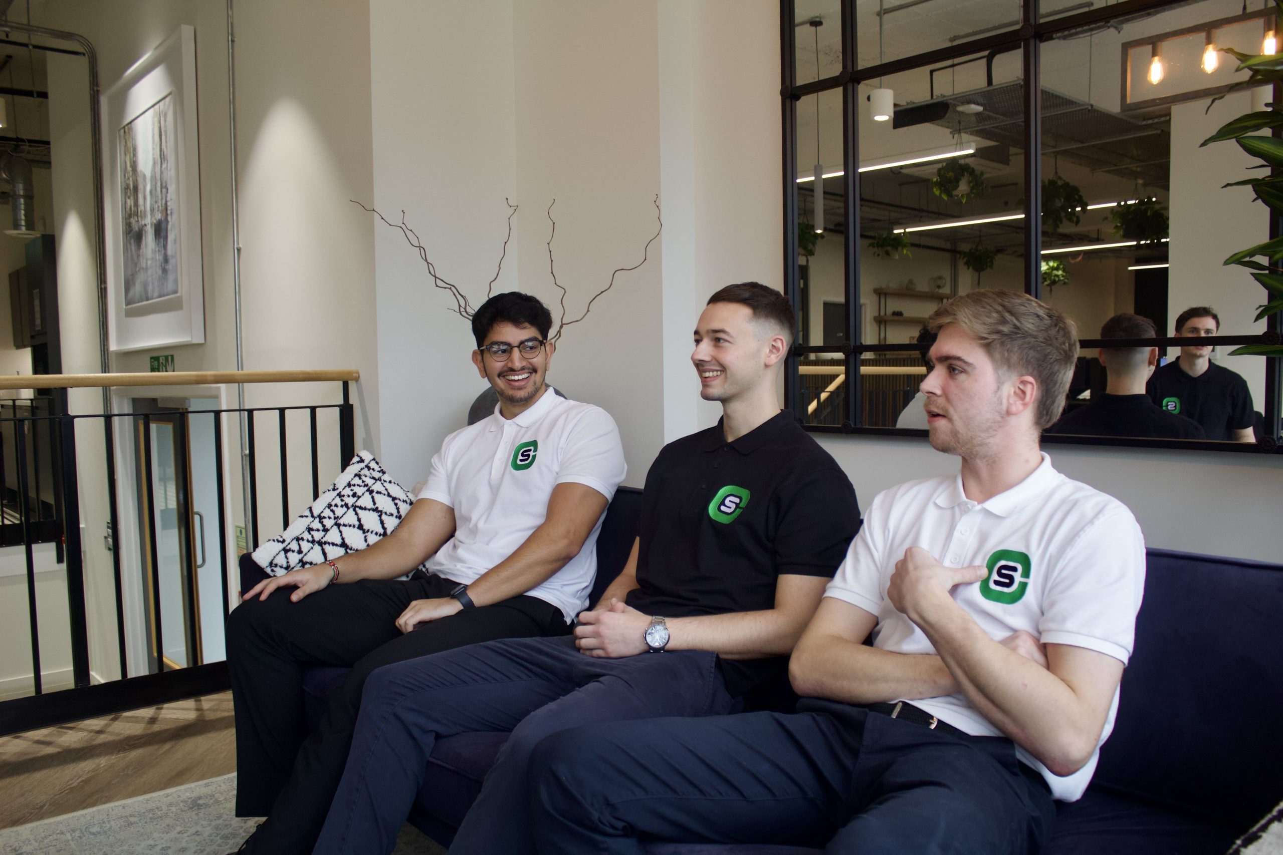 Three employees looking at each other